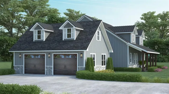 a front view of a house with a garden