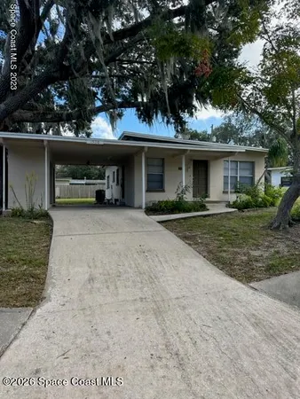 front view of a house with a patio