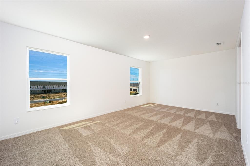 697 Poppy Lane Dundee, FL 33838 - Photo 9 of 16 a view of an empty room with a window