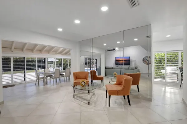 a view of a dining room with furniture window and outside view
