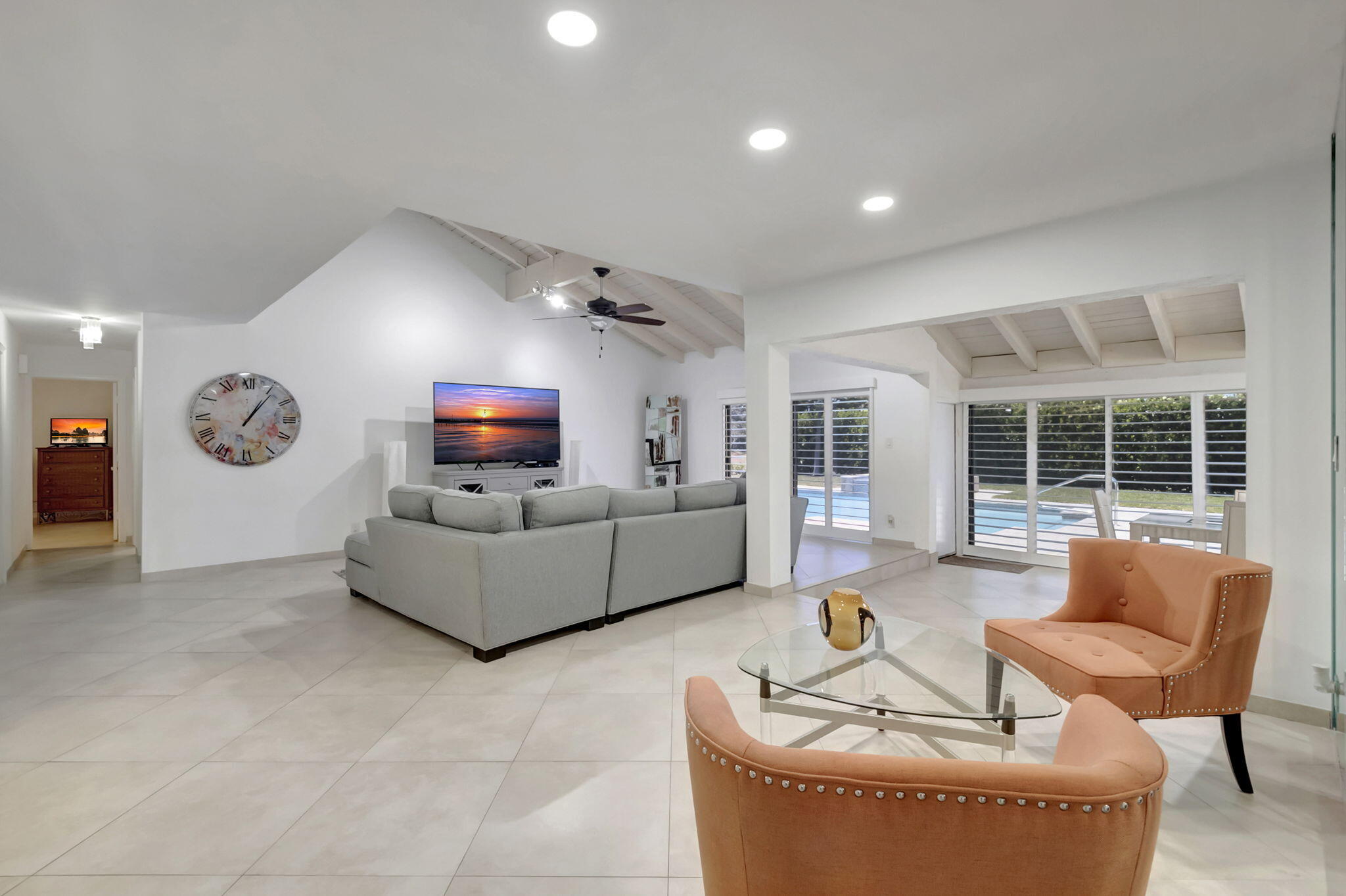 902 Foxpointe Circle Delray Beach, FL 33445 - Photo 12 of 43 a living room with furniture and a flat screen tv
