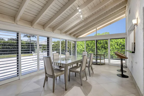a view of a dining room with furniture window and outside view