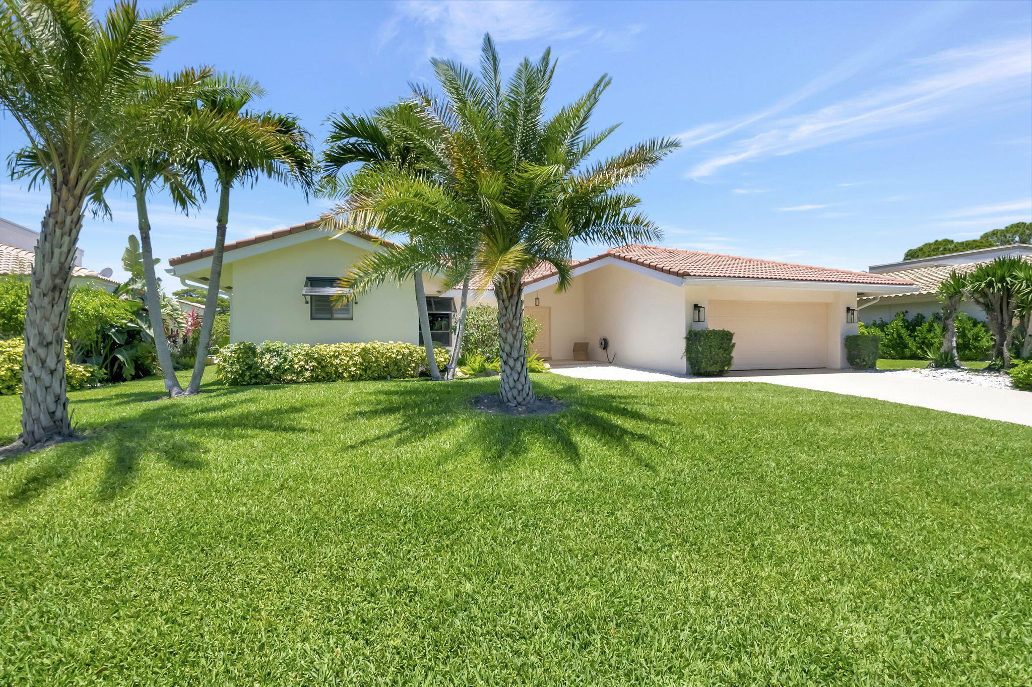 902 Foxpointe Circle Delray Beach, FL 33445 - Photo 2 of 43 a front view of house with yard and green space