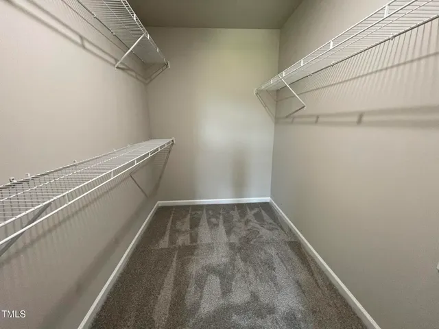 a view of a room with racks on the wall