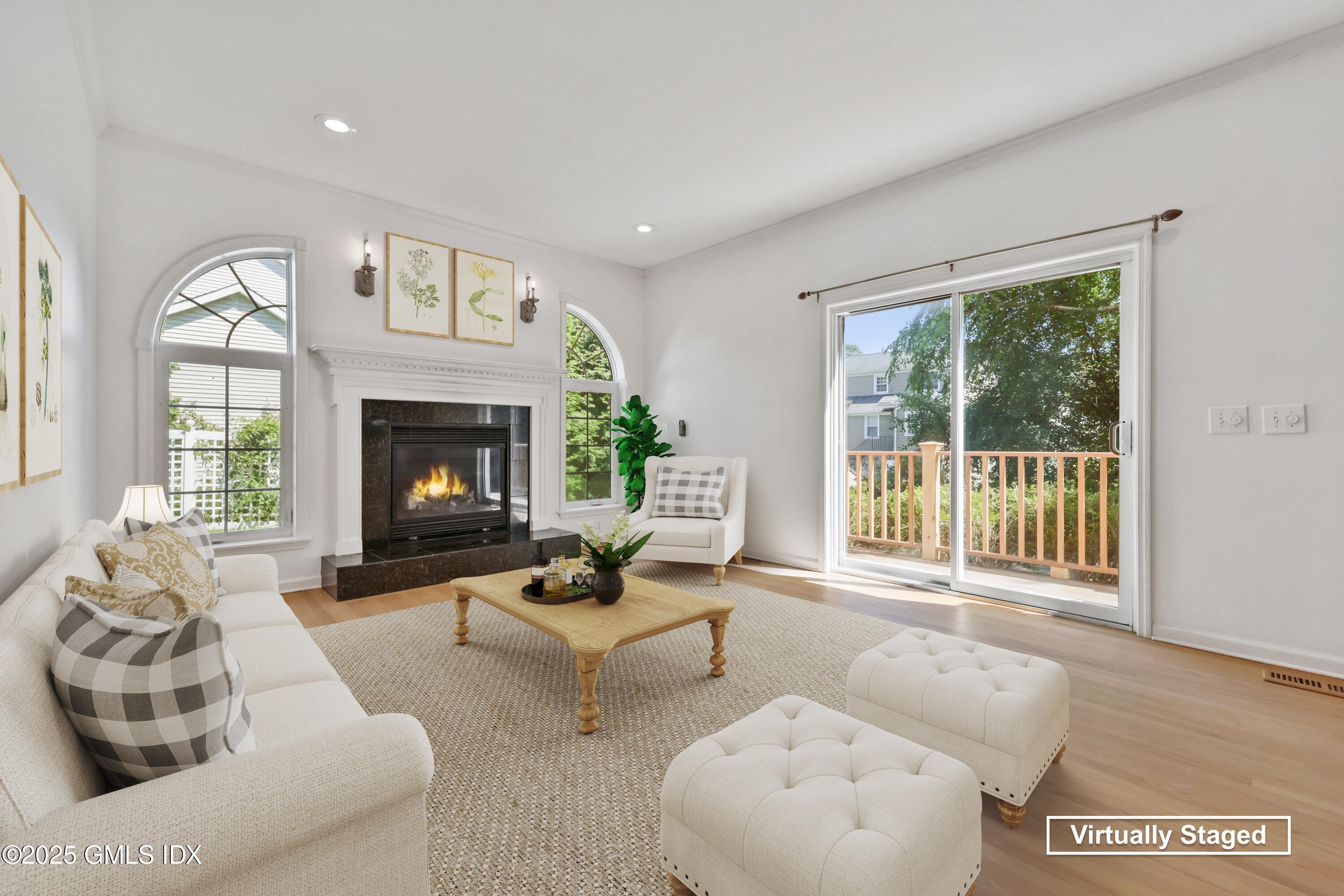 263 Byram Road Greenwich, CT 06830 - Photo 12 of 32 a living room with furniture and a fireplace
