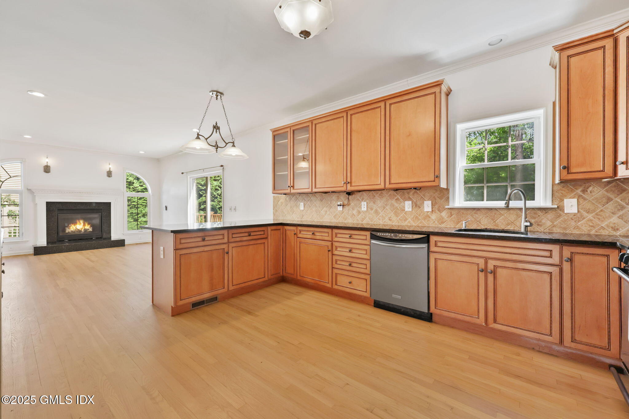 263 Byram Road Greenwich, CT 06830 - Photo 14 of 32 a kitchen with stainless steel appliances granite countertop a stove a sink and a microwave