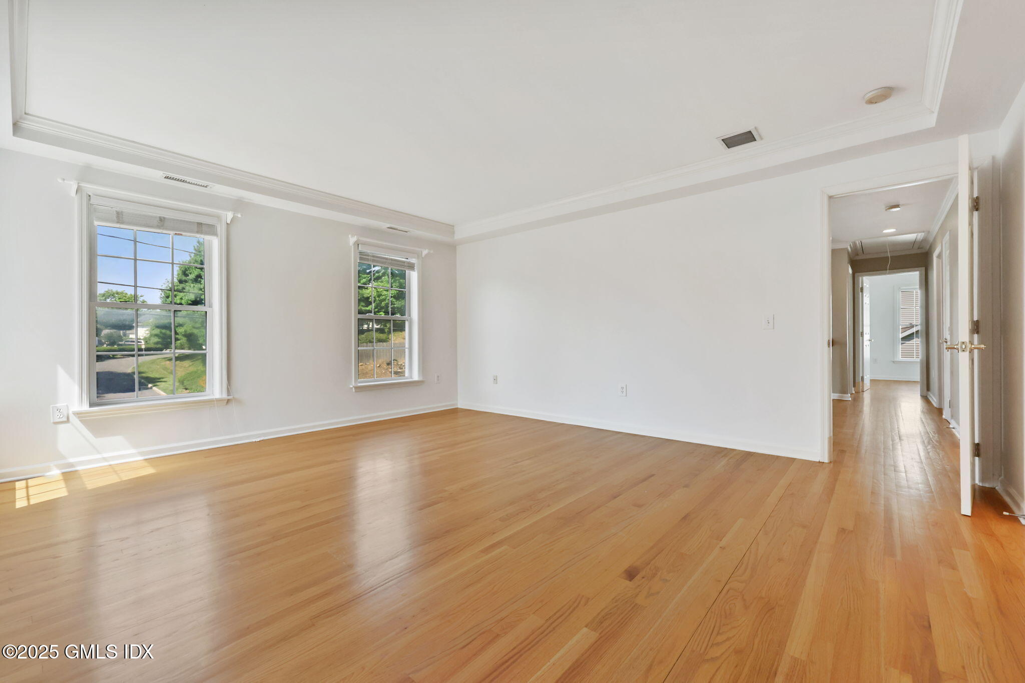 263 Byram Road Greenwich, CT 06830 - Photo 20 of 32 a view of an empty room with wooden floor and a window