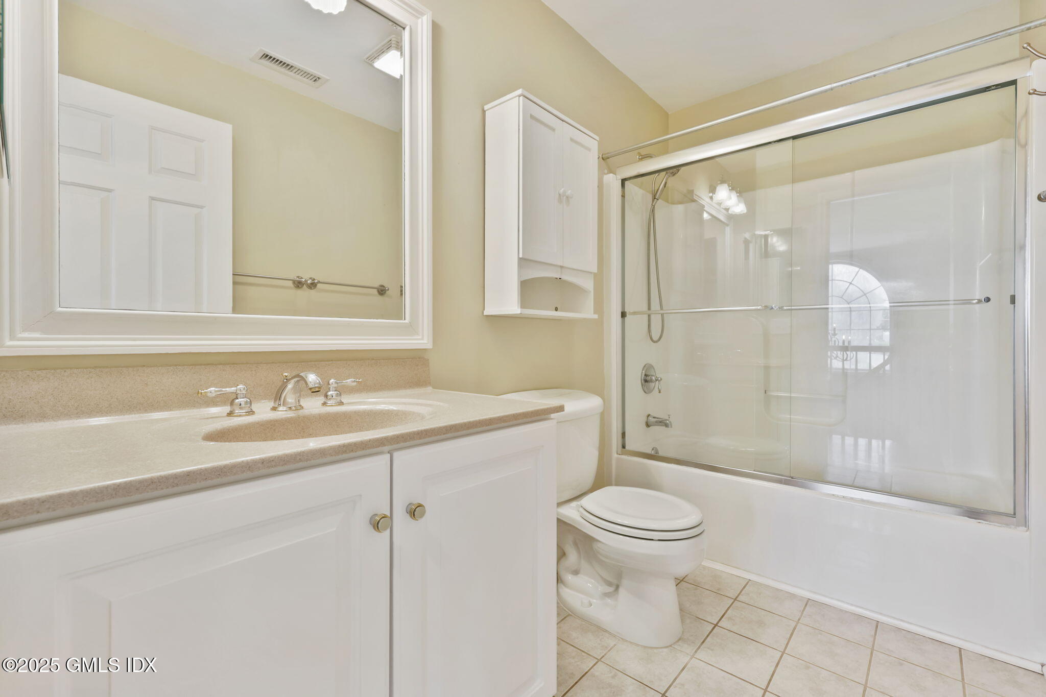 263 Byram Road Greenwich, CT 06830 - Photo 26 of 32 a bathroom with a sink a toilet and shower