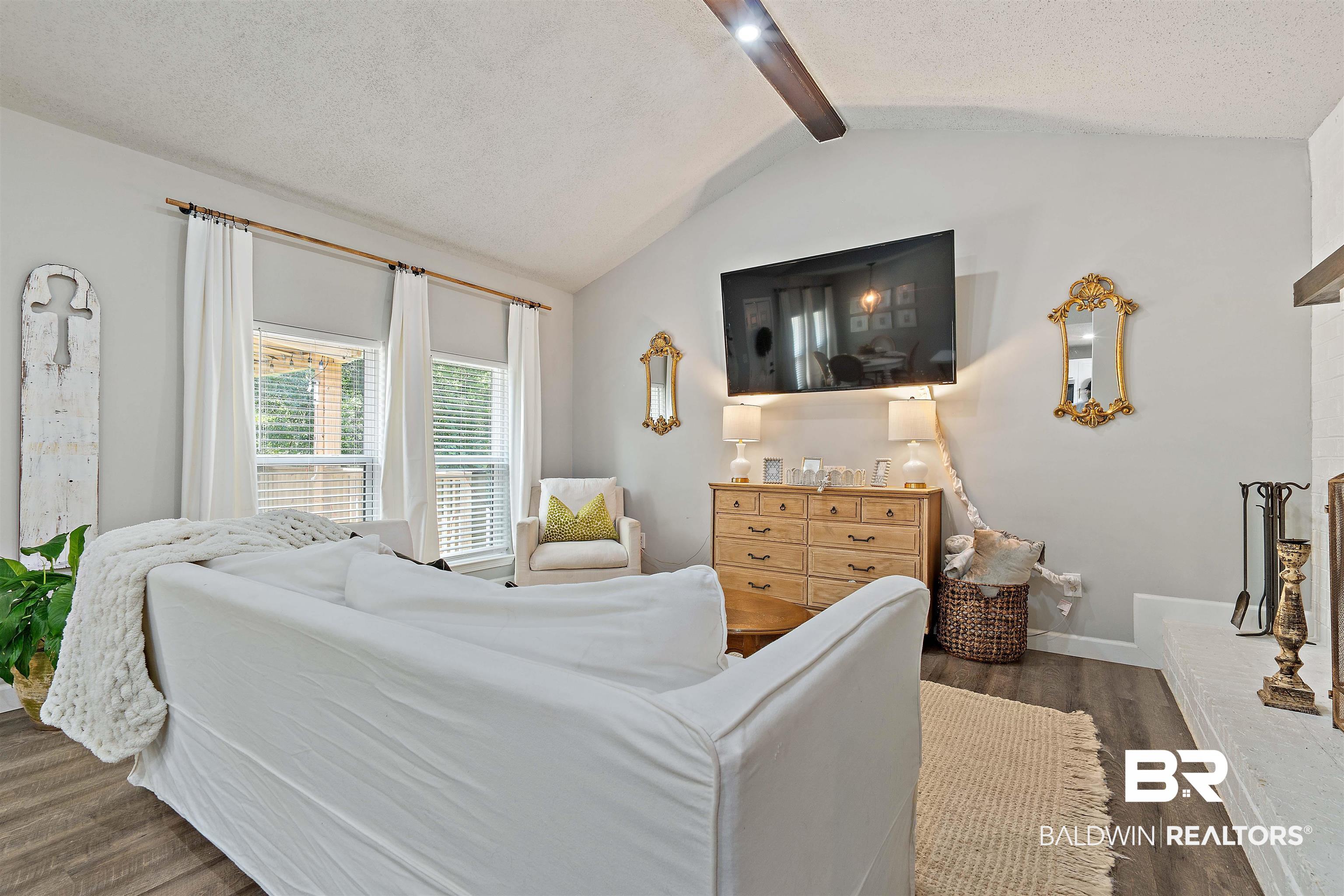 4682 Opal Drive Mobile, AL 36619 - Photo 4 of 27 Bedroom featuring vaulted ceiling with beams, a textured ceiling, ceiling fan, and dark hardwood / wood-style floors