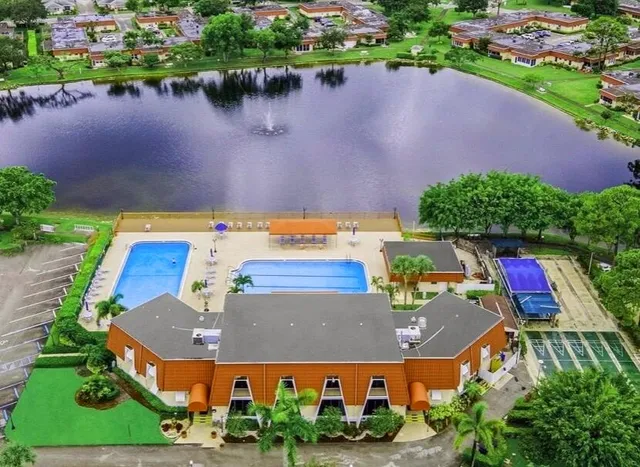 a view of a swimming pool with outdoor seating