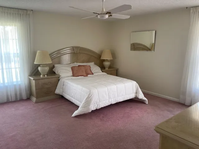 a bedroom with a bed and a cabinets