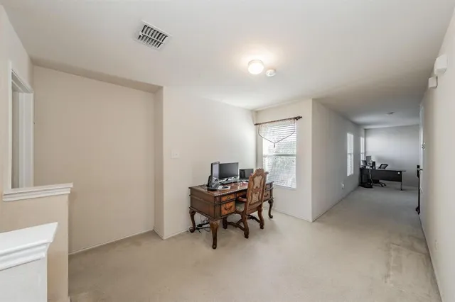 a workspace with furniture and white cabinet