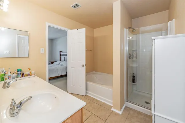 a bathroom with a bathtub and a sink