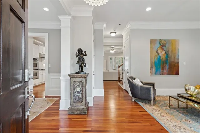 a living room with fireplace furniture and a wooden floor
