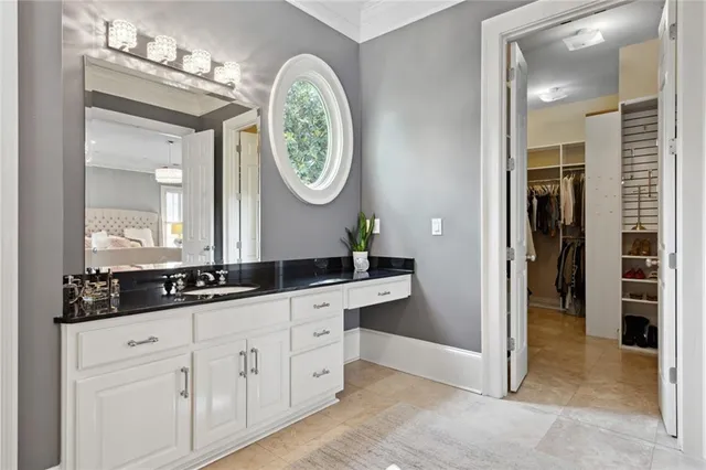 a bathroom with a double vanity sink and a mirror