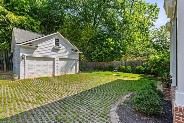 a view of a porch with a floor to ceiling window and wooden floor