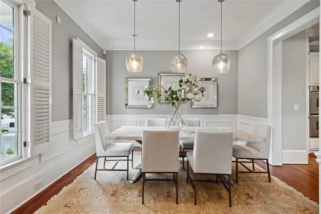 a view of a dining room with furniture window and wooden floor