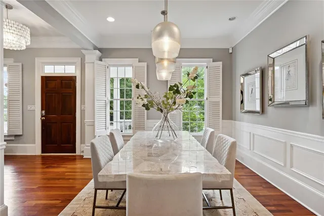 a view of a dining room with furniture window and wooden floor