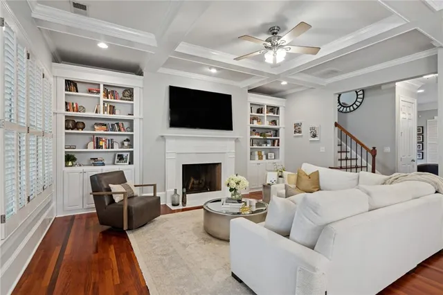 a living room with furniture fireplace and a flat screen tv
