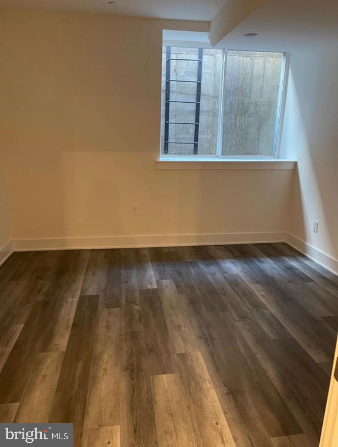 1012 South 20th Street, Unit 4 Philadelphia, PA 19146 - Photo 8 of 9 en empty room with wooden floor