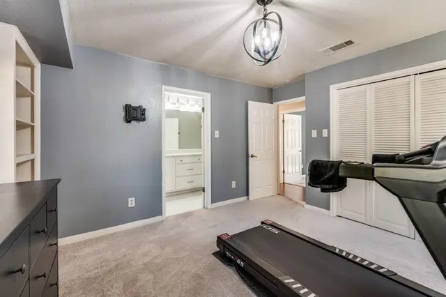 a living room with a bed furniture and a window
