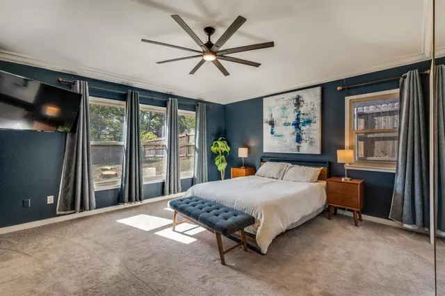 a bed room with a bed and a chandelier