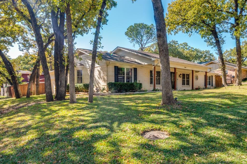 7544 Madeira Drive Fort Worth, TX 76112 - Photo 2 of 25 a front view of a house with a garden