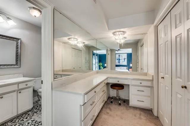 a spacious bathroom with a granite countertop sink mirror and