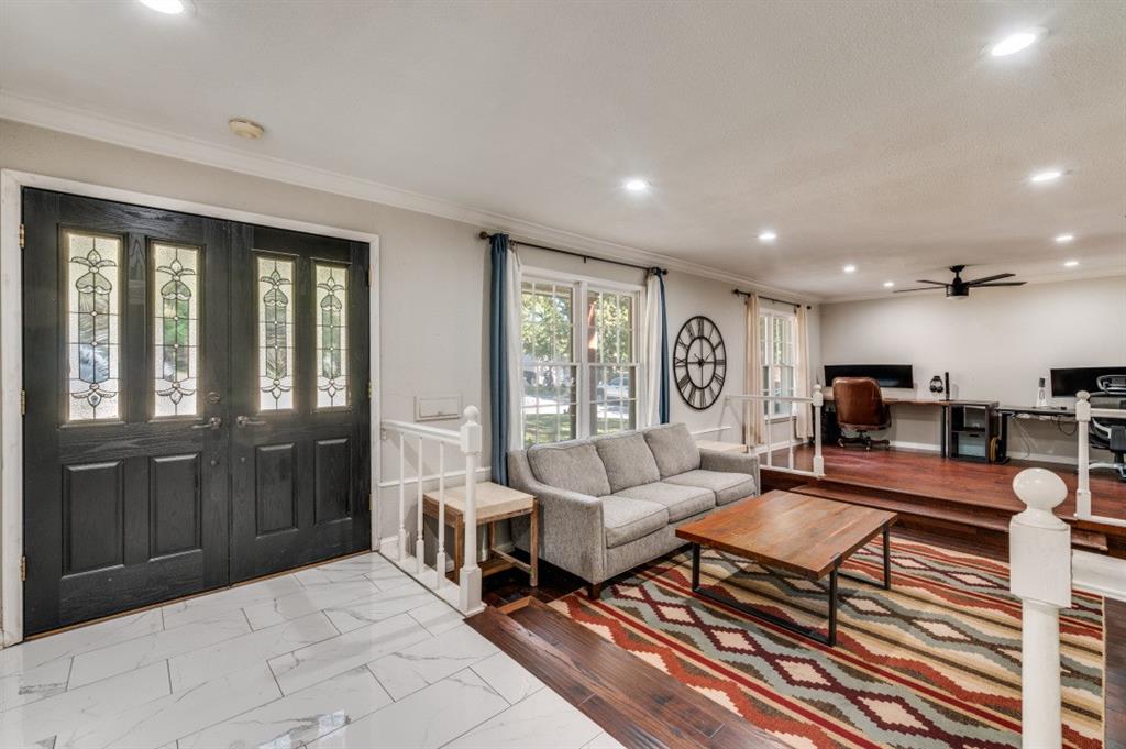 7544 Madeira Drive Fort Worth, TX 76112 - Photo 3 of 25 a living room with furniture and a large window