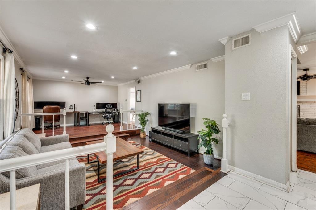 7544 Madeira Drive Fort Worth, TX 76112 - Photo 6 of 25 a living room with furniture and a flat screen tv