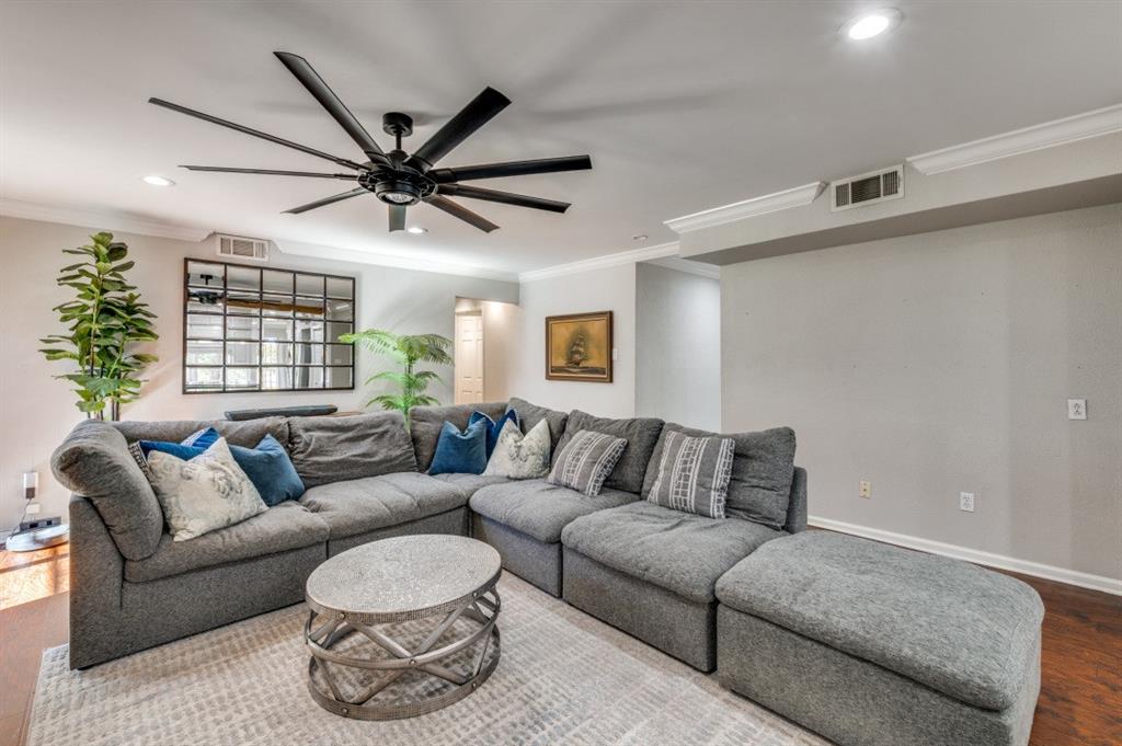 7544 Madeira Drive Fort Worth, TX 76112 - Photo 8 of 25 a living room with furniture and a large window