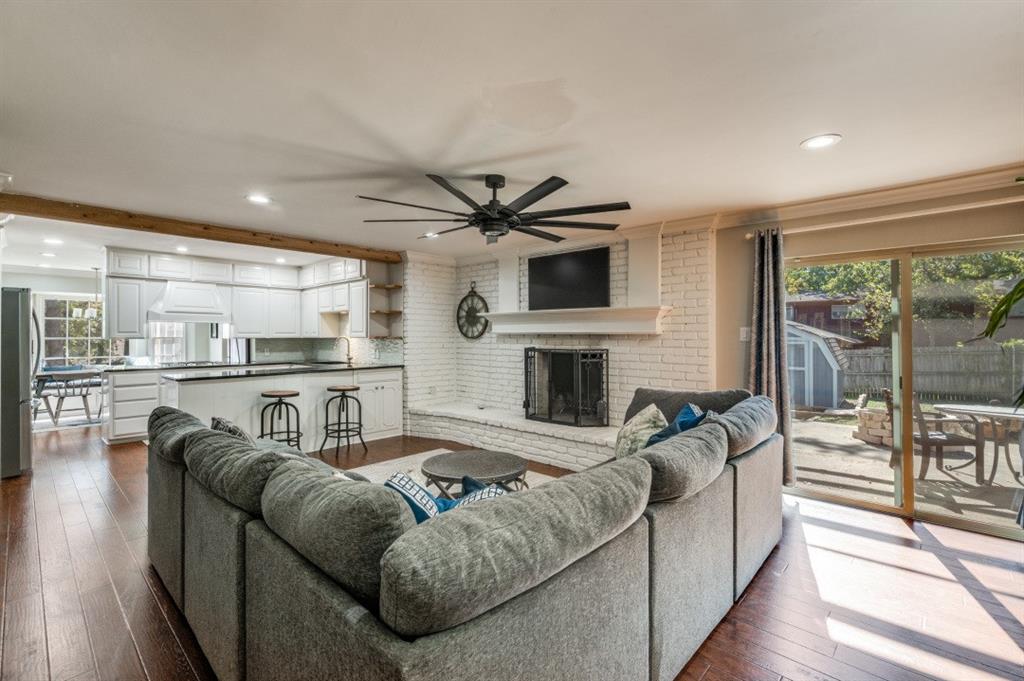 7544 Madeira Drive Fort Worth, TX 76112 - Photo 10 of 25 a living room with furniture and a fireplace