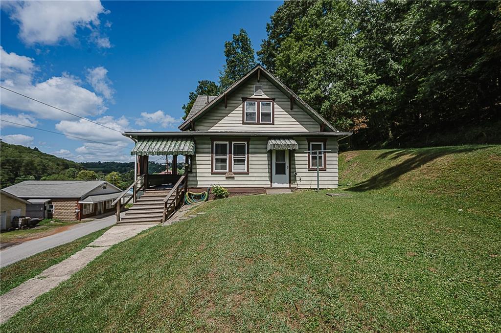 307 Allison Road Clymer, PA 15728 - Photo 1 of 22 a view of a house with a yard deck and furniture