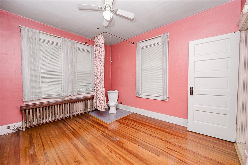 307 Allison Road Clymer, PA 15728 - Photo 12 of 22 a view of empty room with wooden floor and fan