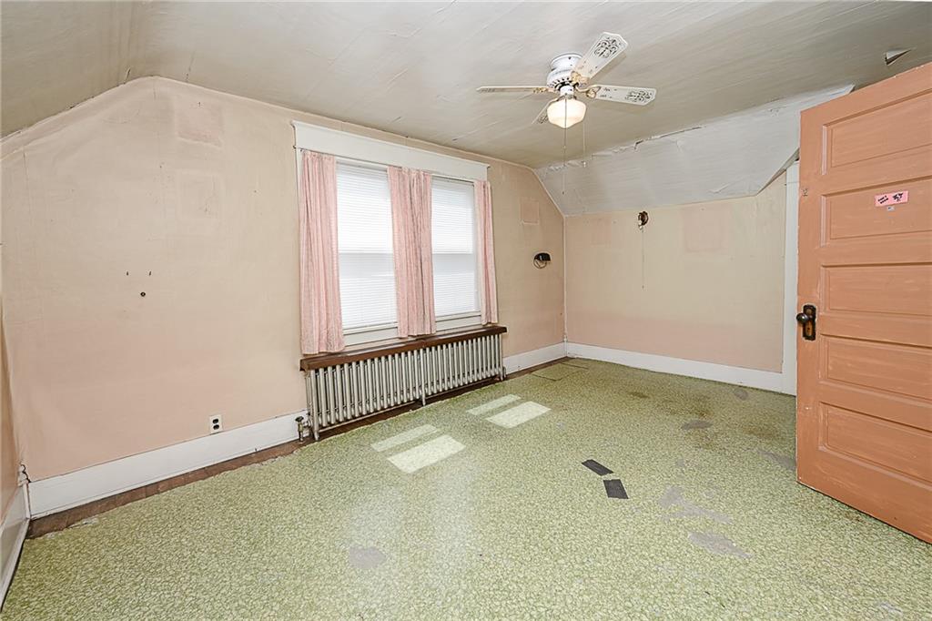 307 Allison Road Clymer, PA 15728 - Photo 13 of 22 an empty room with windows and ceiling fan