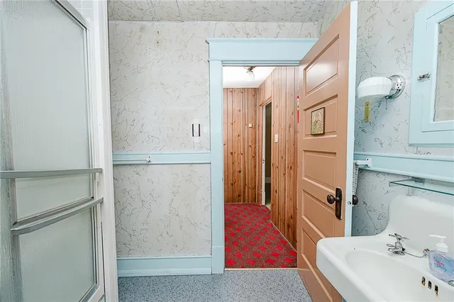 a bathroom with a tub and a sink