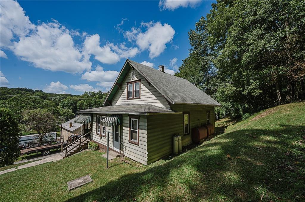307 Allison Road Clymer, PA 15728 - Photo 2 of 22 a view of a house with a yard