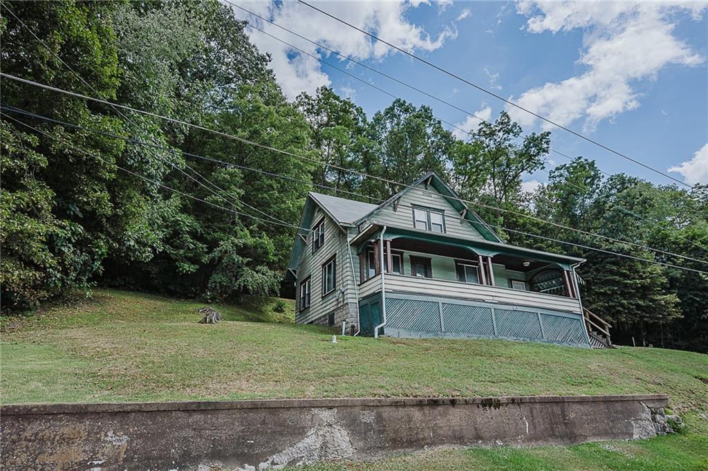 307 Allison Road Clymer, PA 15728 - Photo 21 of 22 a front view of a house with a yard
