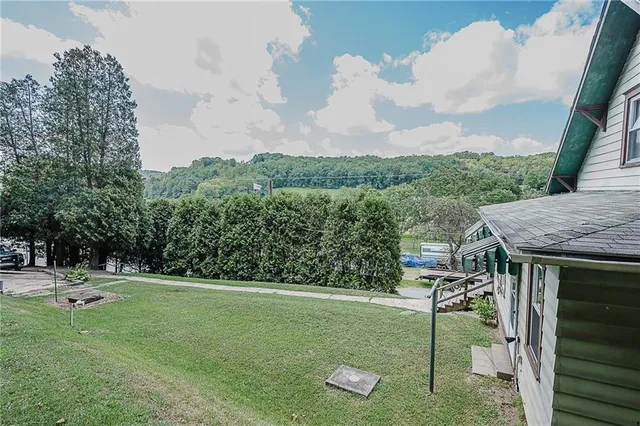 a backyard of a house with lots of green space