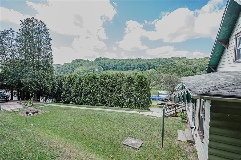 307 Allison Road Clymer, PA 15728 - Photo 22 of 22 a backyard of a house with lots of green space