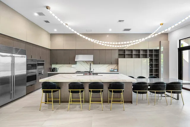 a bathroom with a toilet sink vanity and granite