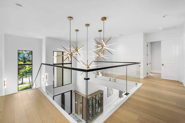 a balcony with furniture and a potted plant