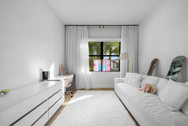 a view of a house with a yard and a garden