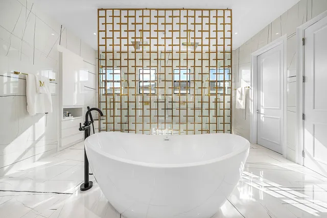 a view of a patio with dining table and chairs under an umbrella