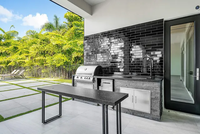 a blue bench sitting in front of a building