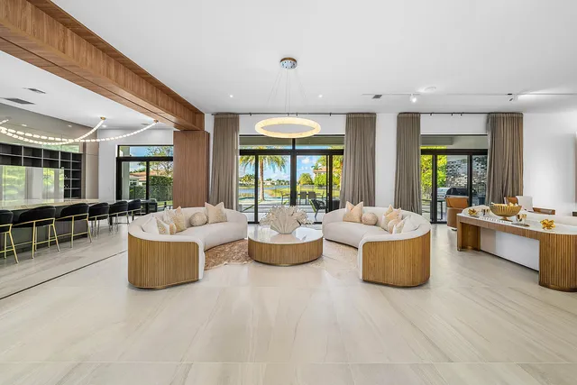 a large kitchen with stainless steel appliances granite countertop a large center island and a sink