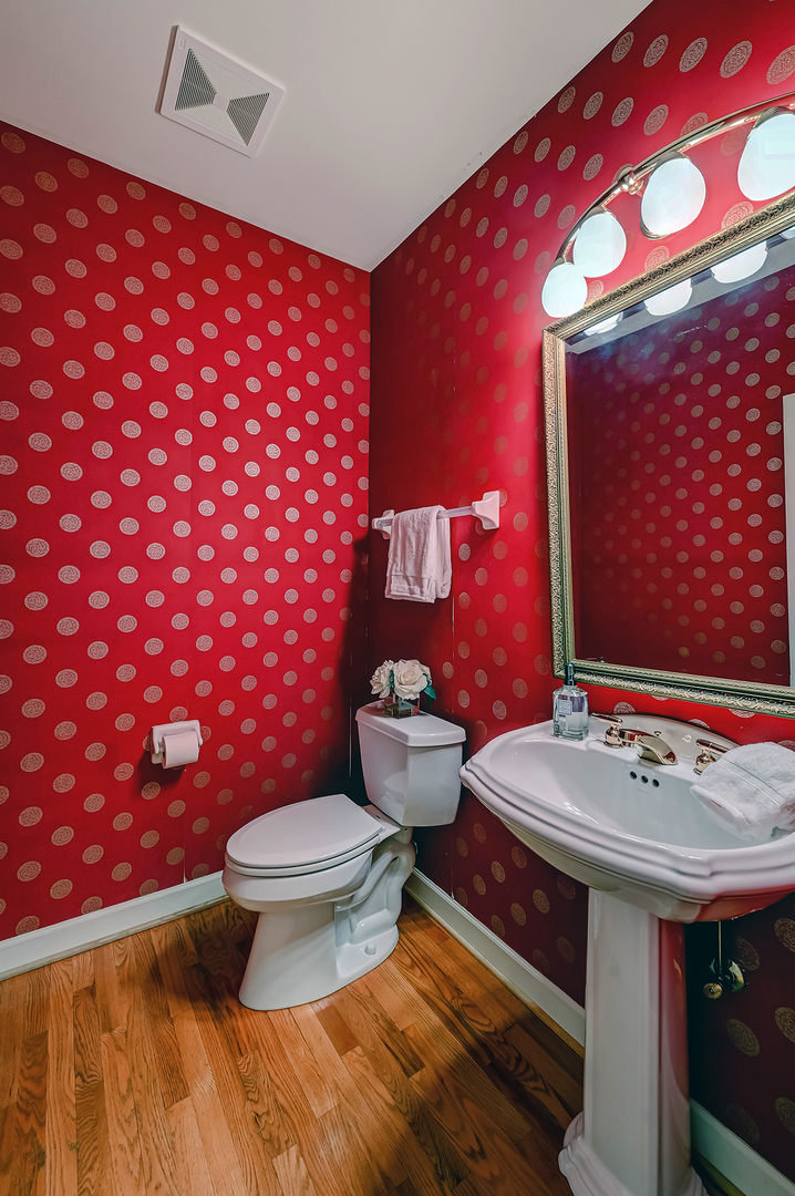 3 Berkshire Lane Burr Ridge, IL 60527 - Photo 17 of 40 a bathroom with a sink mirror vanity and toilet