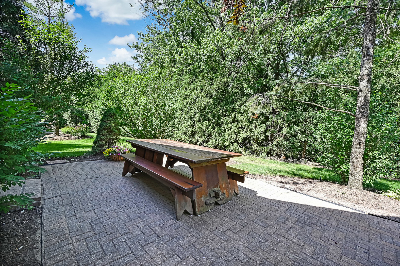 3 Berkshire Lane Burr Ridge, IL 60527 - Photo 38 of 40 a wooden bench sitting in the middle of a park