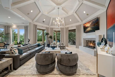 a living room with fireplace furniture and a flat screen tv