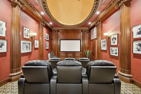 a dining room with furniture and a window